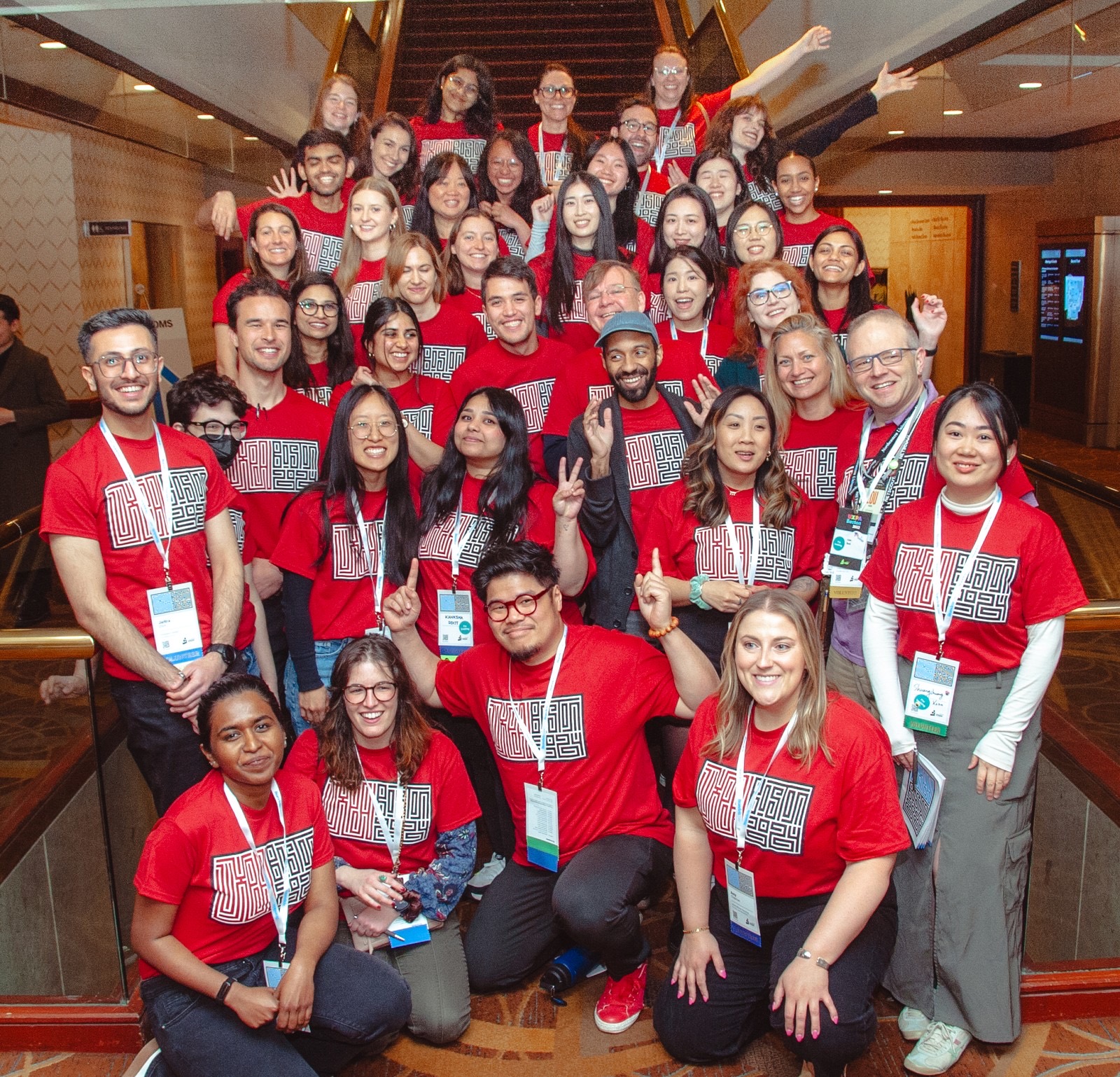 Large group of conference volunteers in matching shirts